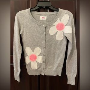 Girls silver shimmer dressy sweater. Size 10. Gently Used. Pink flower accents.
